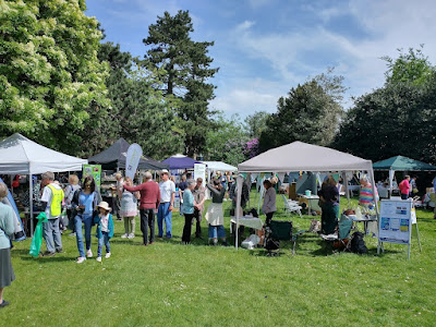 Visitors and stalls in the sunshine at Cool Heswall