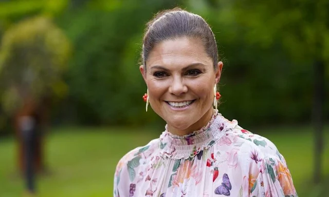 Princess Victoria wore a floral print maxi dress from By Malina. By Malene Birger boucle blazer. Ralph Lauren floral print shirt dress