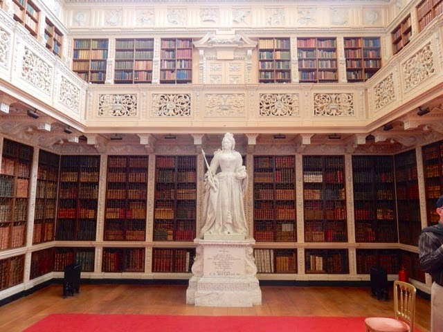 Larger than life Queen Anne statue in the library