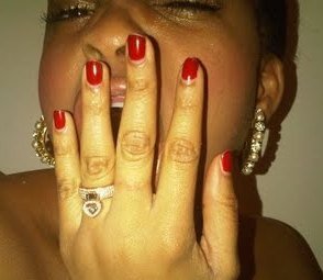 Engagement ring on middle finger