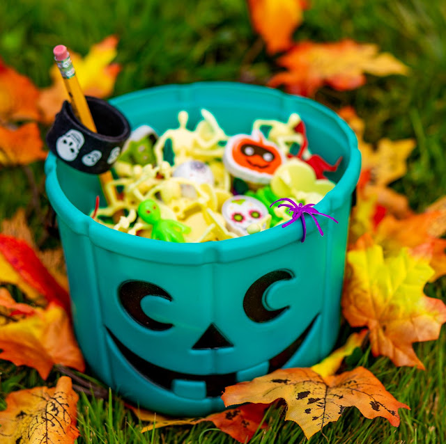 teal Halloween basket full of treats