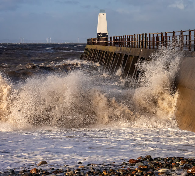 Photo of large waves battering Maryport pier during storm conditions last Friday