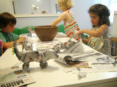 children making paper mache