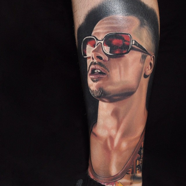 a arm tattoo of Brad Pitt acting in Fight Club