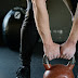 Person holding red kettlebell