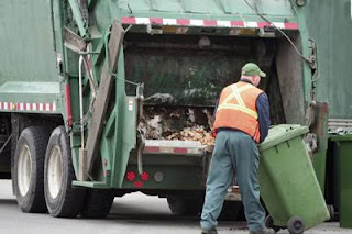 A Cleaner Or Rubbish Collector,A Cleaner,  Rubbish Collector