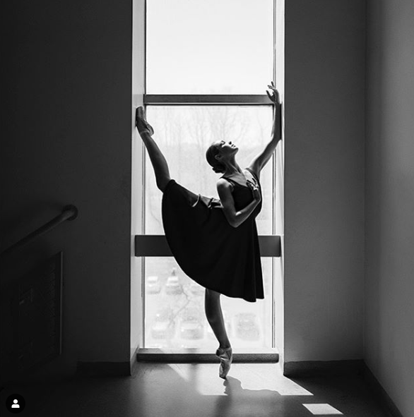 Dancer front of the window with ballet shoes