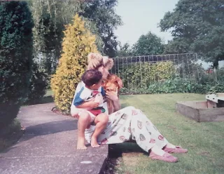 my nephew, dachsund puppy and me in our garden