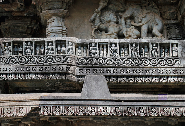 Miniature Balcony kind of structures on the carved on walls of the temple