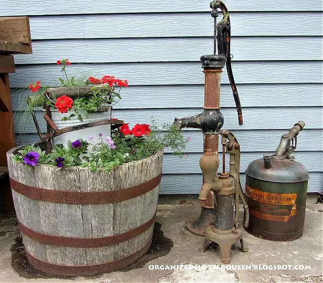 Photo of whiskey barrel planter in the junk garden.