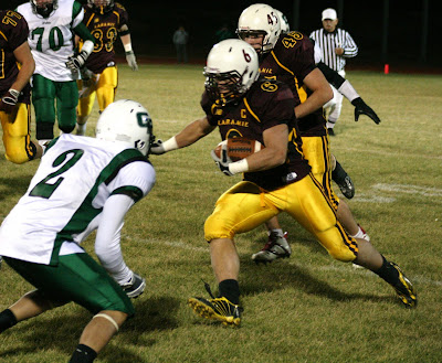 Laramie halfback Jon Sorenson looks to get past Green River's Marcos Munoz 