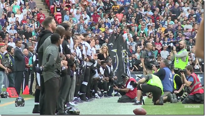 NFL PLayers locked arms at Wembly Stadium