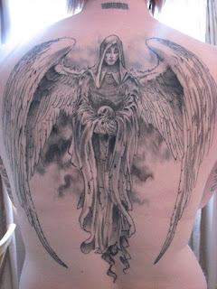 full-back tattoo: Angel of Death holding a human skull