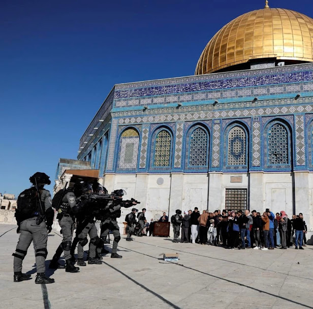 Palestinian civilians against Israeli occupation forces outside the Dome of the rock  on Friday "AP"