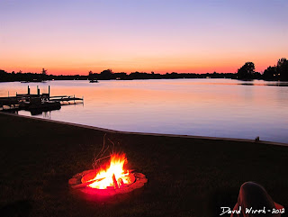 bonfire at the cottage, night fire by the lake, sitting by the fire at the lake