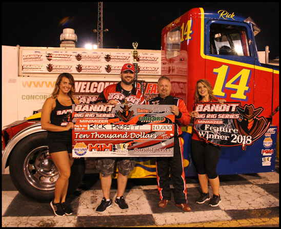 A-main feature race winnner Ricky 'Rude' Proffitt (second from right) 
poses with his $10,000 check at the Bandit Big Rig Series event at 
Concord Speedway Saturday, May 5, 2018