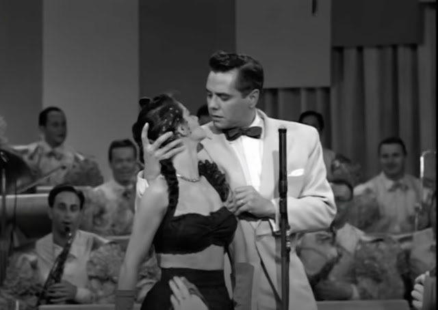 Screenshot from the December 17, 1951 episode of I Love Lucy where Desi performs and clutches a dancer.