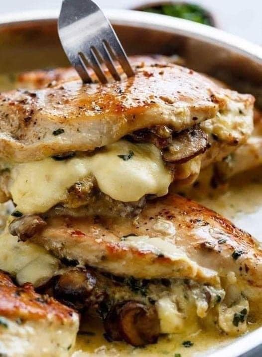 Chicken stuffed with cheese, garlic butter and mushrooms