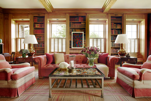 Rose tufted sofas in panelled library Meadowmere Southampton home by Carrier and Company