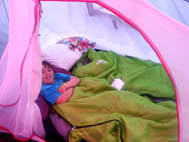 Boy in Sleeping Bag inside Tent