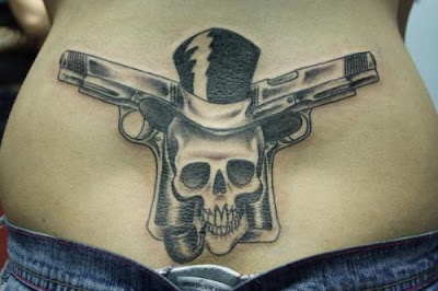 guns and skull tattoos