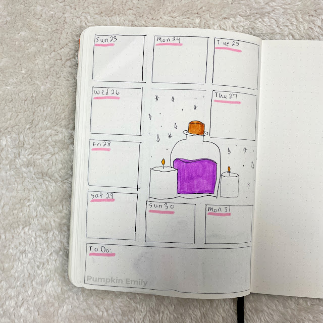 A one page weekly spread with a potion bottle and two candles.