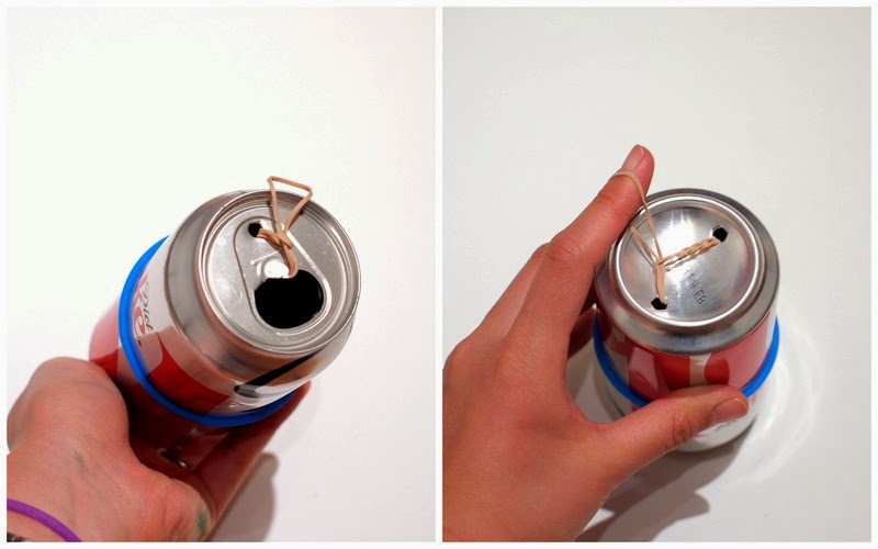 pierce two holes in both ends of the soda can