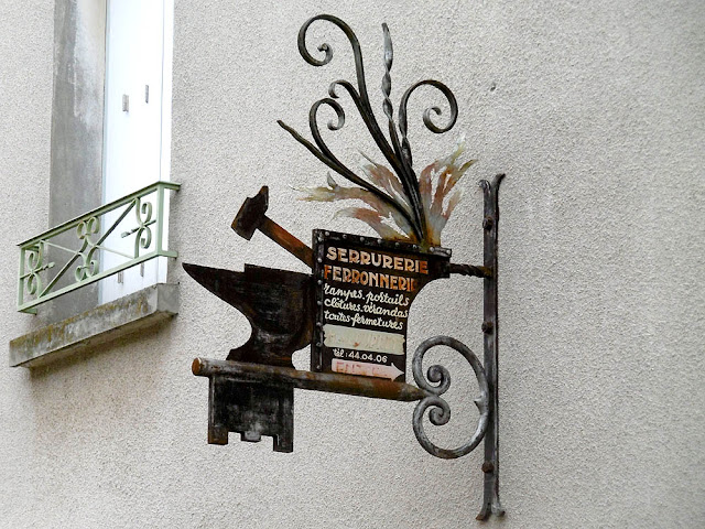 Locksmith's sign, Loir et Cher, France. Photo by Loire Valley Time Travel.