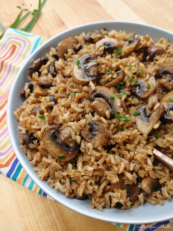 Garlic Butter & Mushroom Rice! Fresh mushrooms sautéed with garlic and butter cooked with rice on the stovetop in a savory, beefy stock for a quick and easy side dish.