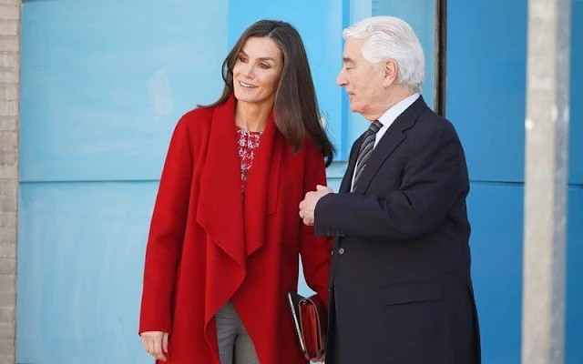 Queen Letizia wore a Catifa wool cashmere shawl-collar red coat by Hugo Boss, and crosshatch houndstooth blouse by Carolina Herrera