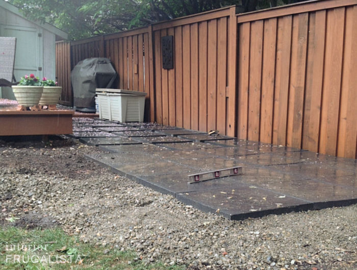 Budget-friendly DIY paver block patio with crushed gravel mix base.