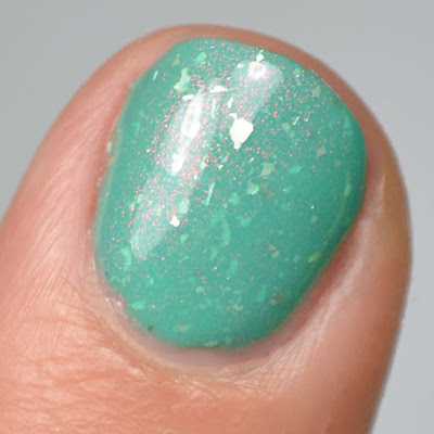 green nail polish with shimmer swatch