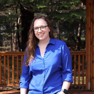 A photograph of Museum Manager Megan Webb standing in a gazebo