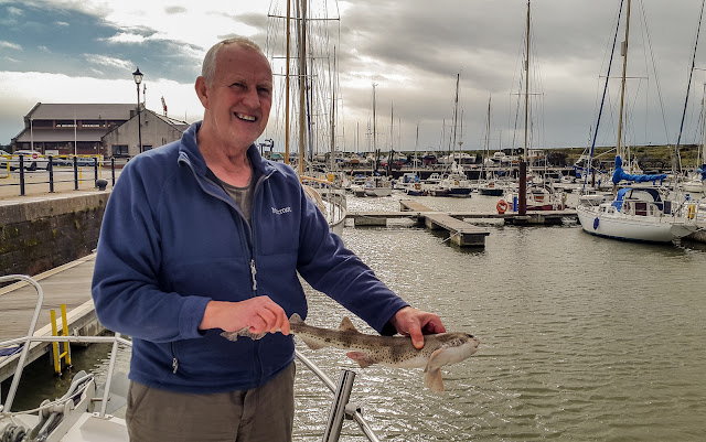 Photo of Phil posing for a photo with the dogfish 