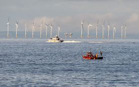 Photo of the local fisheries vessel and a small fishing boat on the Solway Firth