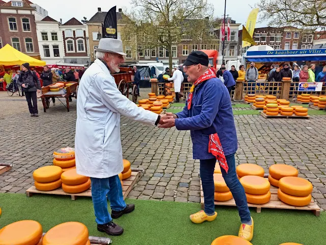 buyer and seller negotiating the price of the cheese