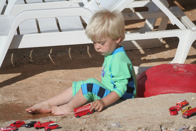 Anton playing with cars.