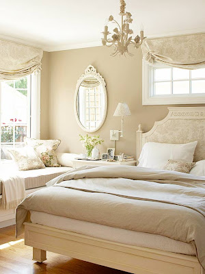 Soft taupe and cream toile fabric adorns the windows and headboard in this