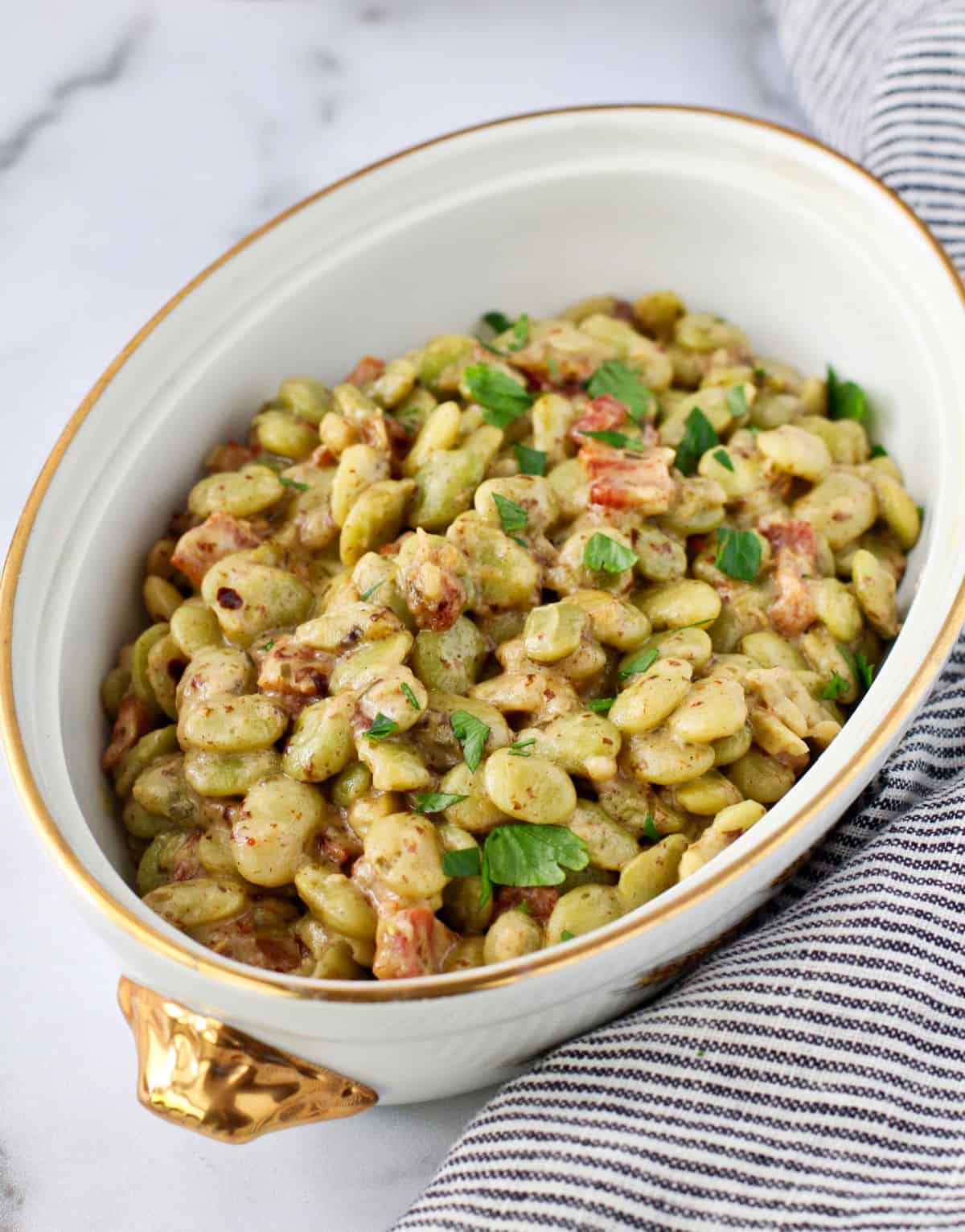 Creamed Lima Beans with Bacon in a casserole dish.