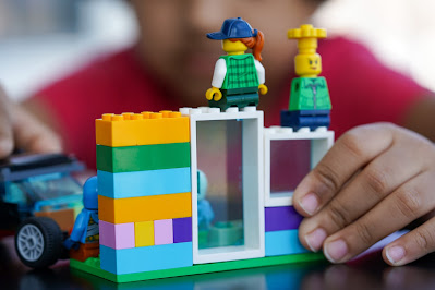 child playing with Lego