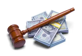 A gavel and money symbolizing the compensation that a personal injury lawyer in Los Angeles can help you get.