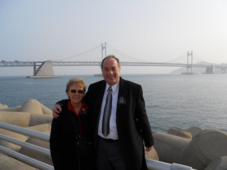 We stand by near the bridge that crosses the harbor.