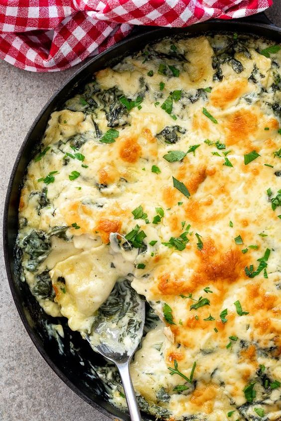 Creamy spinach baked ravioli made with shop-bought ravioli is an easy, delicious vegetarian dinner recipe perfect for busy weeknights. #bakedravioli #vegetarian