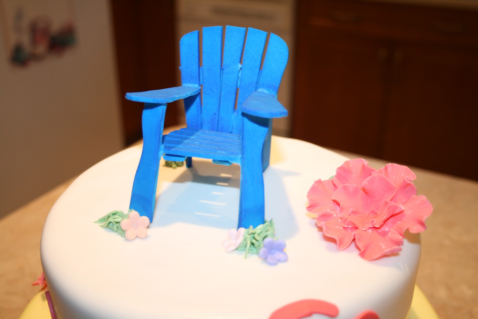 mini Adirondack chair made of fondant and sprayed blue to give it