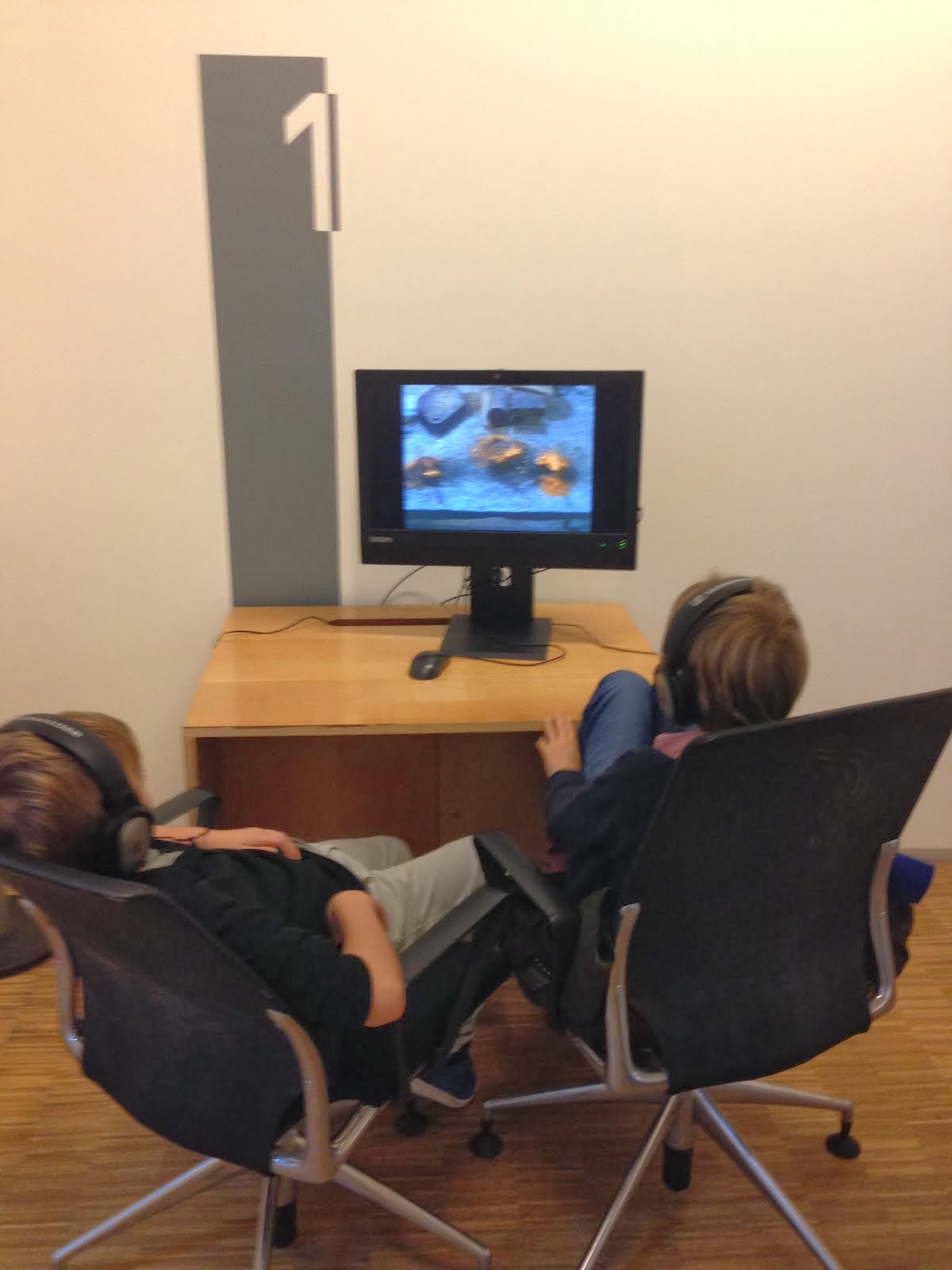 Boys watching films at Pompidou