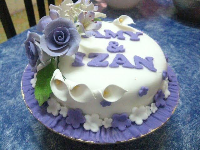 2 tiers White Purple fondant cakes ordered by Mr Kamaruzaman for his 