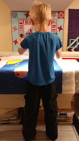 Longarm quilting by six year old boy