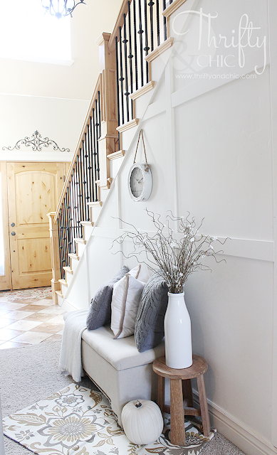 Two story entrway or foyer. White and neutral decor and decorating ideas for Fall.