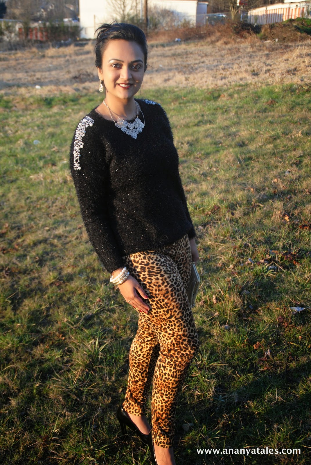 Black pumps, leopard print pants, golden accessories, golden clutch, black furry sweater