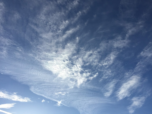 blue sky wispy clouds